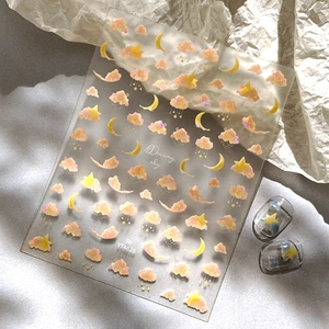 Dreamy sky nail stickers featuring pink clouds and yellow stars with 3D effect