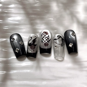 Black swan handmade press-on nails with silver glitter and rhinestones on mid-long trapezoid