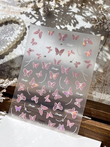 Autocollants ongles papillon exquis avec dégradé laser rose et détails en strass