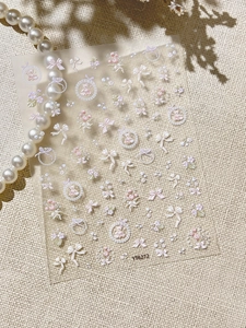 Detail of 3D embossed nail stickers with floral tulip and bow designs YT6272
