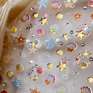 3D embossed sea shell nail stickers with starfish and rhinestones on silk background