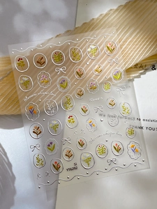 Detailed view of silver stamping floral nail stickers with cute tulip and daisy patterns