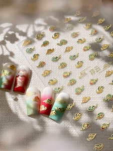 Detailed view of Chinese auspicious cloud nail stickers with gold embossed textures