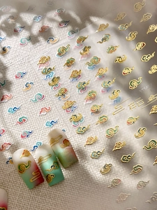 Detailed view of Chinese auspicious cloud nail stickers with 3D gold embossed texture