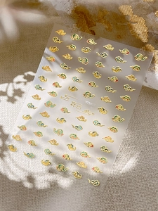 Detail of 5D gold embossed Chinese cloud nail stickers with textured leaf shadow effect