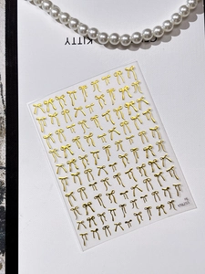 Detailed view of YT6255 gold 3D bow nail art stickers with elegant pearl accents