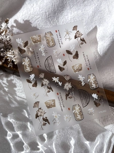 Macro view of Chinese style embossed lotus nail stickers with calligraphy and ink details