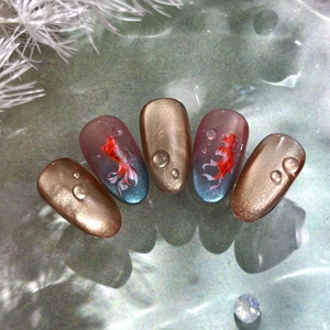 Exquisite koi fish press-on nails with golden cat-eye effect and 3D water drop accents
