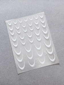 Macro detail of French manicure tip guides for DIY nail art design model YT4010