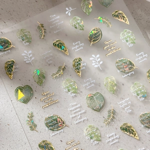 Gold-stamped leaf nail art stickers with laser holographic effect and plant designs
