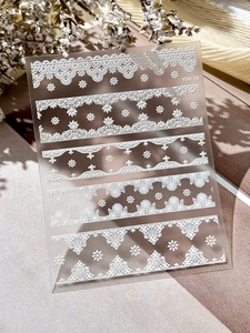 Detail view of YT4119 white embossed lace nail stickers with floral patterns