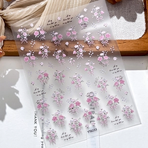 Pink embossed rose and bow nail art stickers with delicate floral patterns for DIY manicure