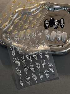 3D embossed skeletal hand nail stickers in metallic gold and silver with various gestures
