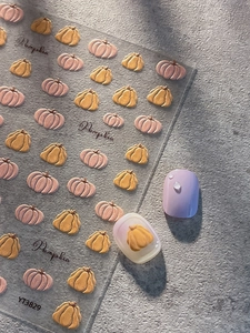 5D embossed pumpkin nail stickers for Halloween on purple nails with YT3829 text