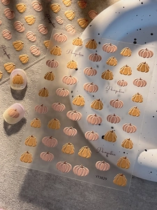 Detail shot of YT3829 embossed pumpkin nail stickers with 3D texture for autumn manicure