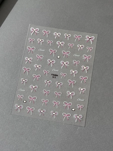 Detail of sweet bow-knot nail stickers with rhinestone accents and Sweet lettering YT6084