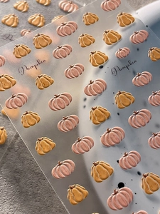 Macro view of 3D embossed pumpkin nail art stickers with intricate texture details