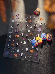 Close-up of Halloween nail art stickers with 5D embossed pumpkin and ghost designs