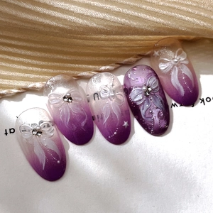 Gradient purple press-on nails with 3D white bow ribbons, pearls and rhinestones