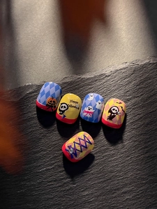 Detail of Halloween nail art stickers with ghosts, skulls and glitter embossed textures