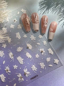 3D embossed white floral nail stickers with butterfly motifs and sparkling rhinestones