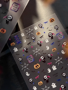 Detailed view of 5D embossed Halloween nail stickers with ghosts and pumpkins