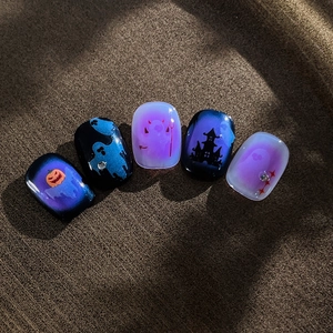 Halloween ghost and pumpkin nail art kit with purple gradient design and crystal accents