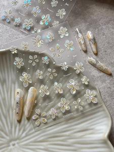 Detail of 5D embossed frangipani nail stickers with iridescent pearl luster finish