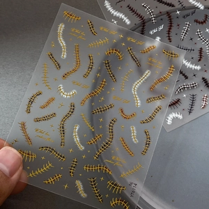Golden fishbone Halloween nail stickers with metallic punk stitches for DIY manicure decoration