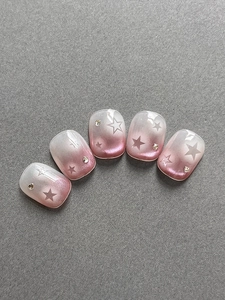 Short square pink gradient star nail tips with cat eye shimmer and small rhinestones