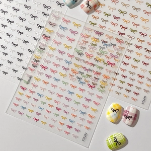 3D embossed bow nail art stickers in various colors with plaid pattern demonstration