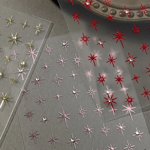 Sparkling hexagram nail art stickers with metallic gold finish and crystal rhinestones