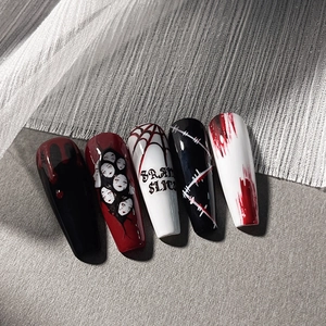 Gothic Halloween coffin press-on nails featuring red blood splatters and spider web designs