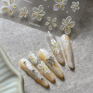 Relief frangipani flower nail stickers with marble pattern and rhinestone accents