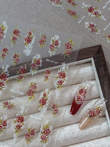 Detailed relief rose nail art stickers with white lace textures and floral motifs