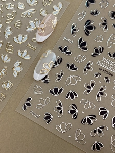 Autocollants à ongles 3D détaillés en or et argent avec motifs floraux minimalistes