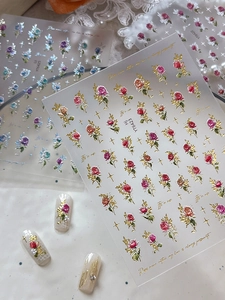 Detailed 5D embossed nail stickers featuring vintage roses and stars with metallic relief