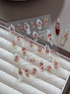 Detail of Rose Diary embossed nail art stickers with vintage red floral patterns and lace