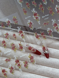 Detail of YT6301 nail art stickers featuring red roses and white lace patterns