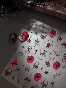 3D spider nail stickers with red rhinestones and web patterns for Halloween nail art
