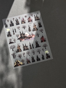 Detail of Halloween nail stickers featuring embossed castles, bats and moon in dark gothic style
