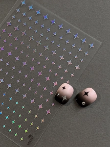 Detailed holographic star nail stickers featuring laser finish and gradient nail art design