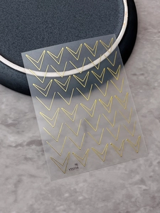 Detail view of YT5516 gold V-shaped geometric nail art stickers with metallic finish