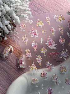 Macro detail of 5D embossed Christmas nail stickers with 3D snowflake and ice cream patterns
