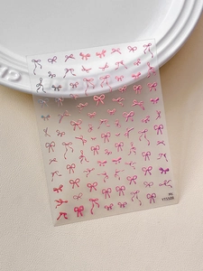 Detail of 3D embossed nail art stickers with pink-purple gradient bow patterns YT5508