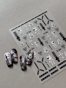 Detailed macro view of 3D gothic silver rabbit and heart embossed nail art stickers