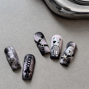 Gothic press-on nails with purple-black gradient, featuring 3D cross and bear charms