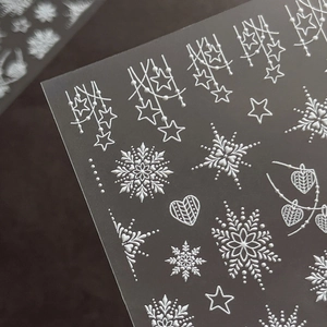 3D embossed snowflake and star nail art stickers with elegant white textured designs