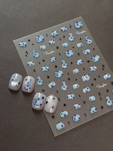 Detailed 5D relief nail art stickers featuring blue pumpkins and black stars texture