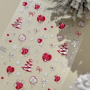 Stickers ongles de Noël avec pommes rouges, flocons de neige et motifs argentés